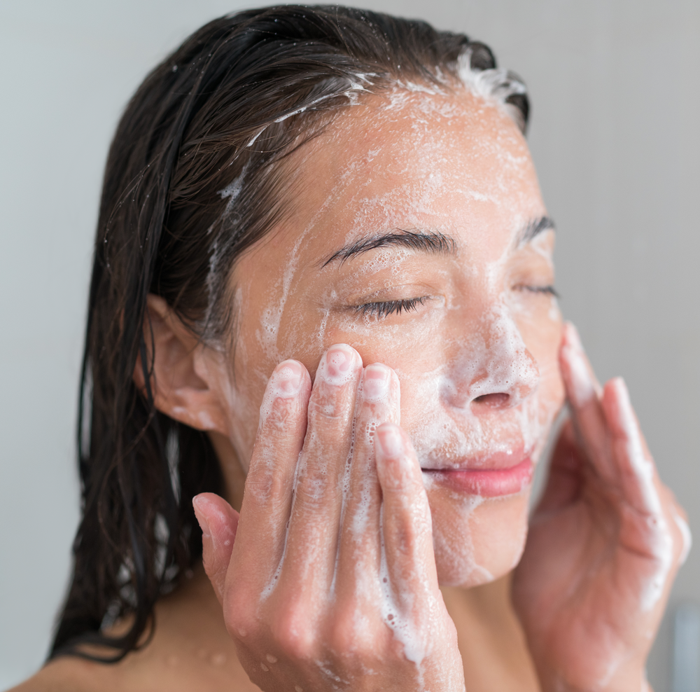 U Beauty Blog | Strip Alert: What's Really Causing Your Breakouts? | image of woman cleansing her face