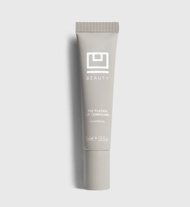 Beige tube of The Plasma Lip Compound by Beauty, 15ml size, with ridged cap and white logo.