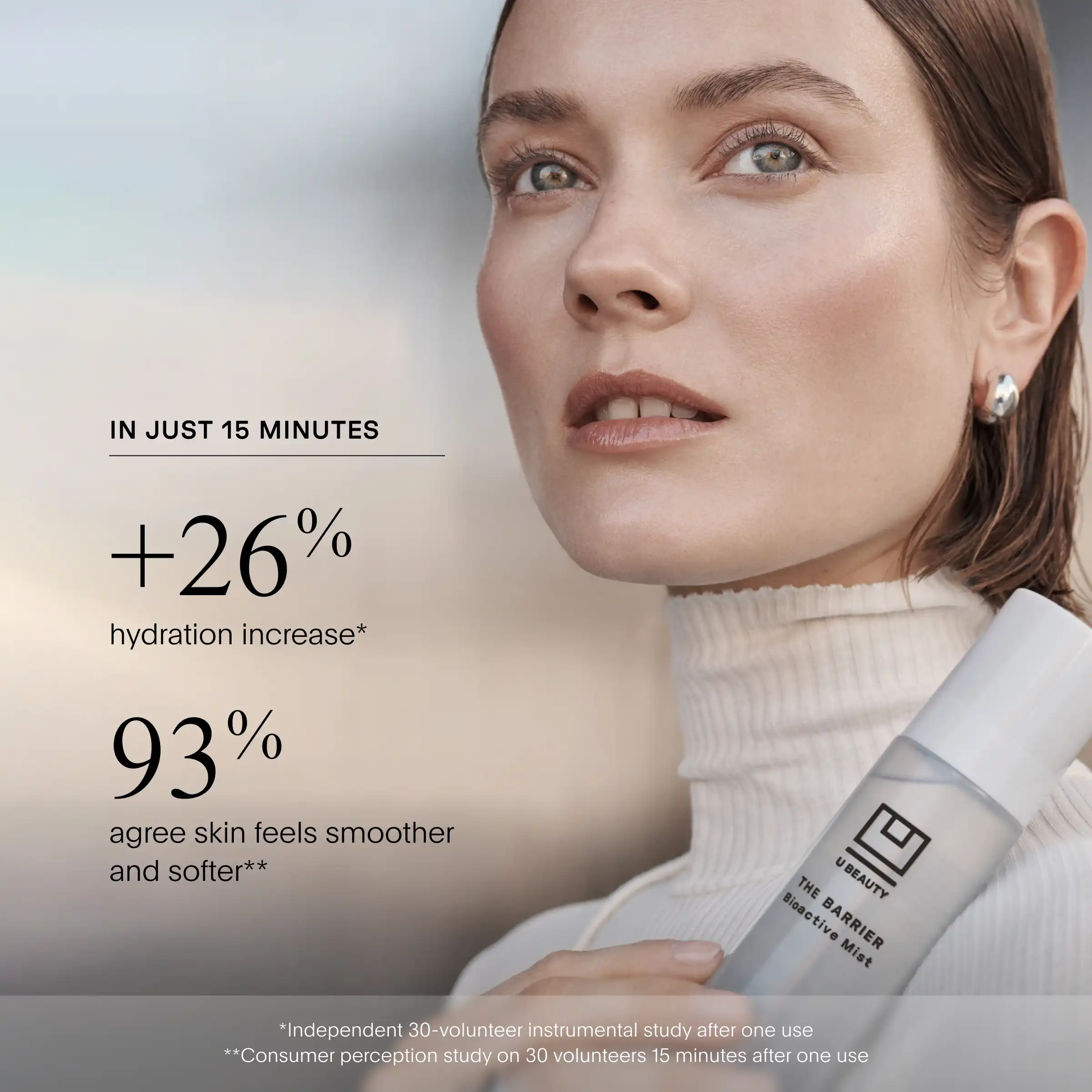 Woman holding The BARRIER Bioactive Mist spray bottle against her neck and shoulder, displaying product label and hydration c