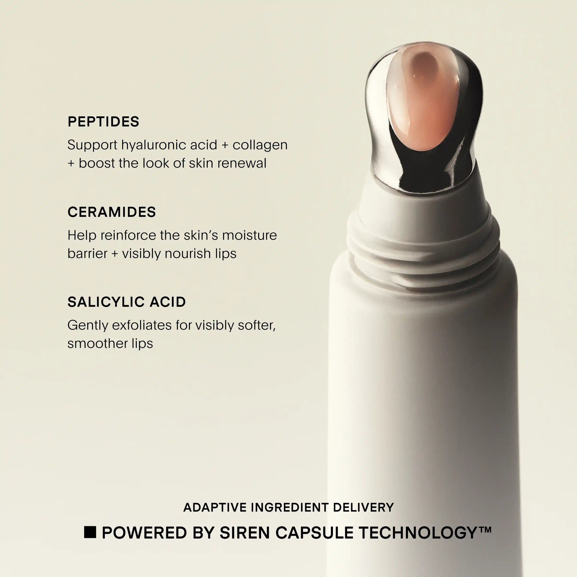 White cylindrical lip treatment device with black applicator head and rose-gold dome-shaped tip, displayed against beige back