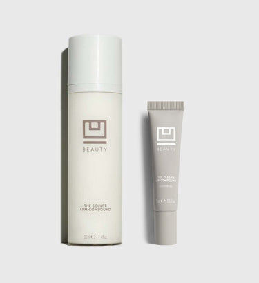 Two-piece beauty set with cream-colored cylindrical bottle labeled "The Sculpt Arm Compound" and smaller tube labeled "The Pl