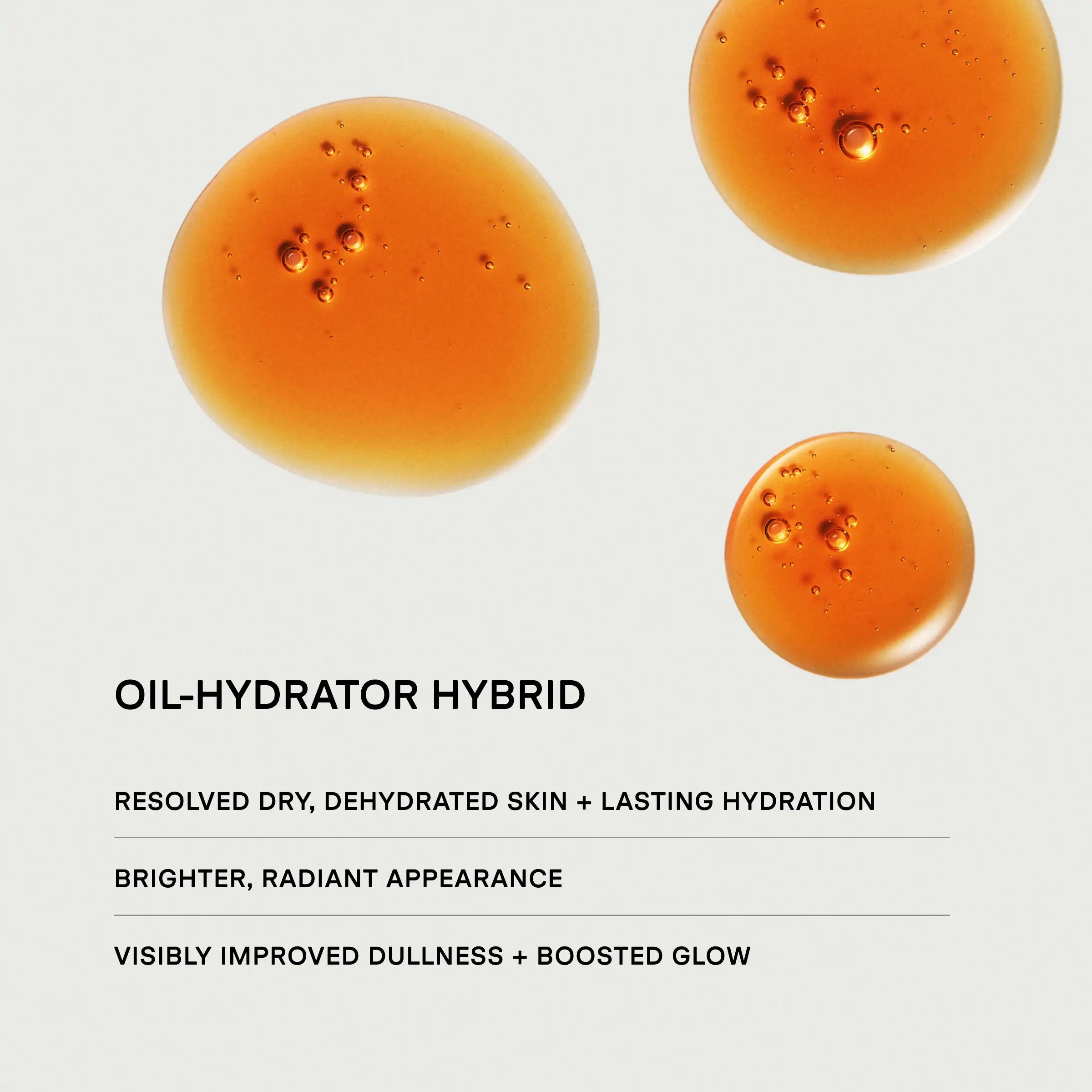 Three golden-orange oil droplets with visible bubbles on a white background.