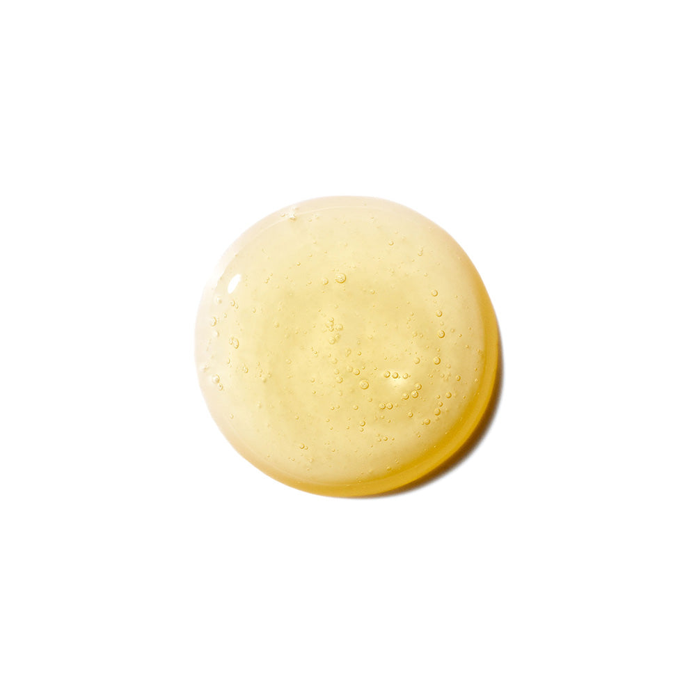 Pale yellow circular product with textured surface and small bubbles visible throughout.
