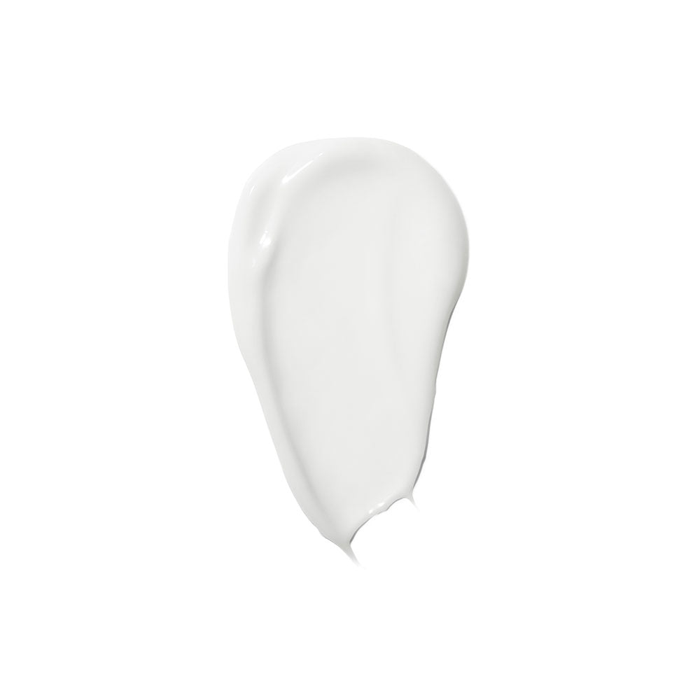 White cream or lotion swatch with curved, organic shape against white background.